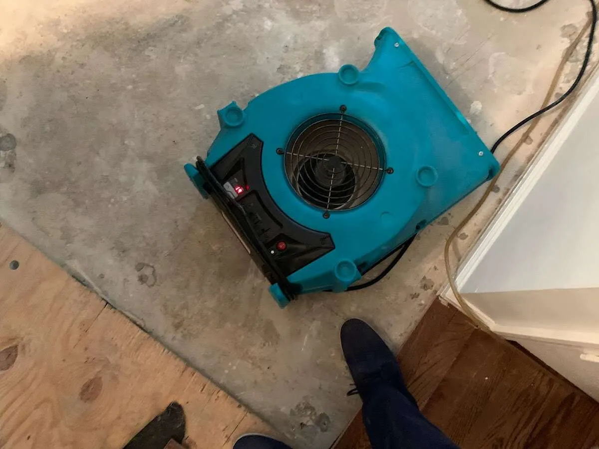 Air mover drying subfloor during Commercial Water Damage Restoration in Forest Acres